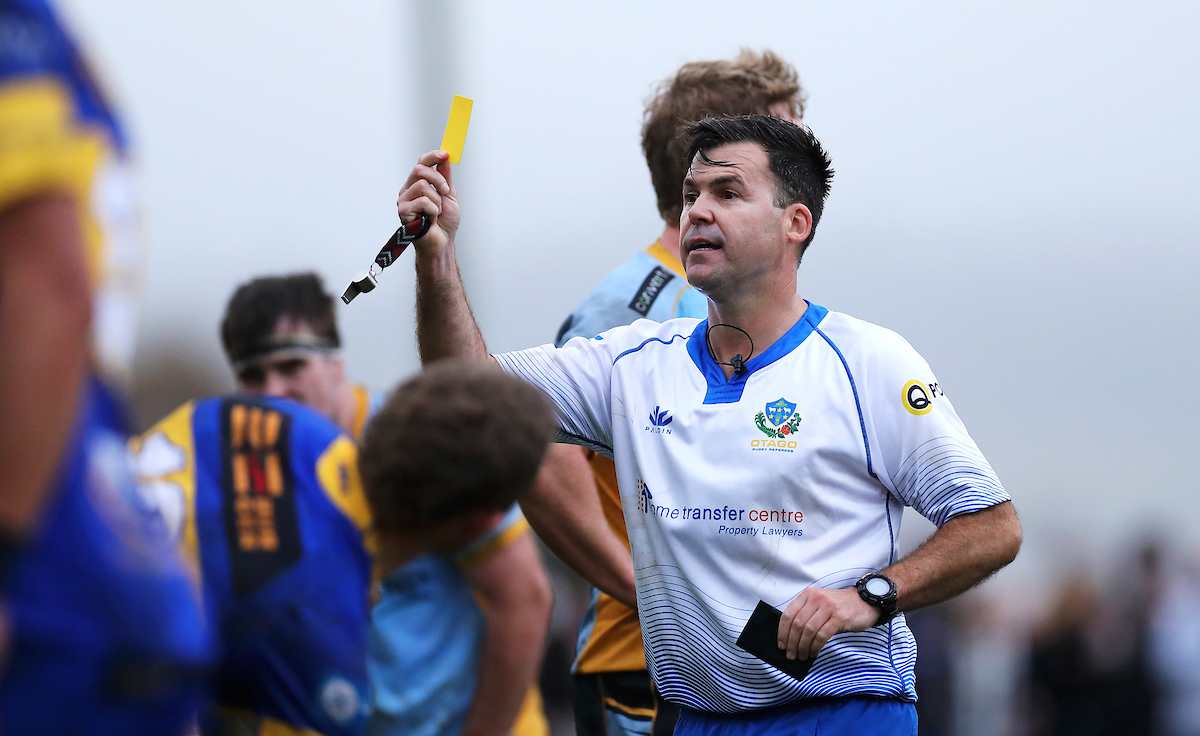 Referee Tim Lucas shows a yellow card to Taier's Sam Fischli during the premier club rugby match between Taieri and University played for the Paul Sapsford Memorial Trophy, played at Peter Johnstone Park in Dunedin on Saturday 14th May, 2022. © John Caswell / http://www.caswellimages.com