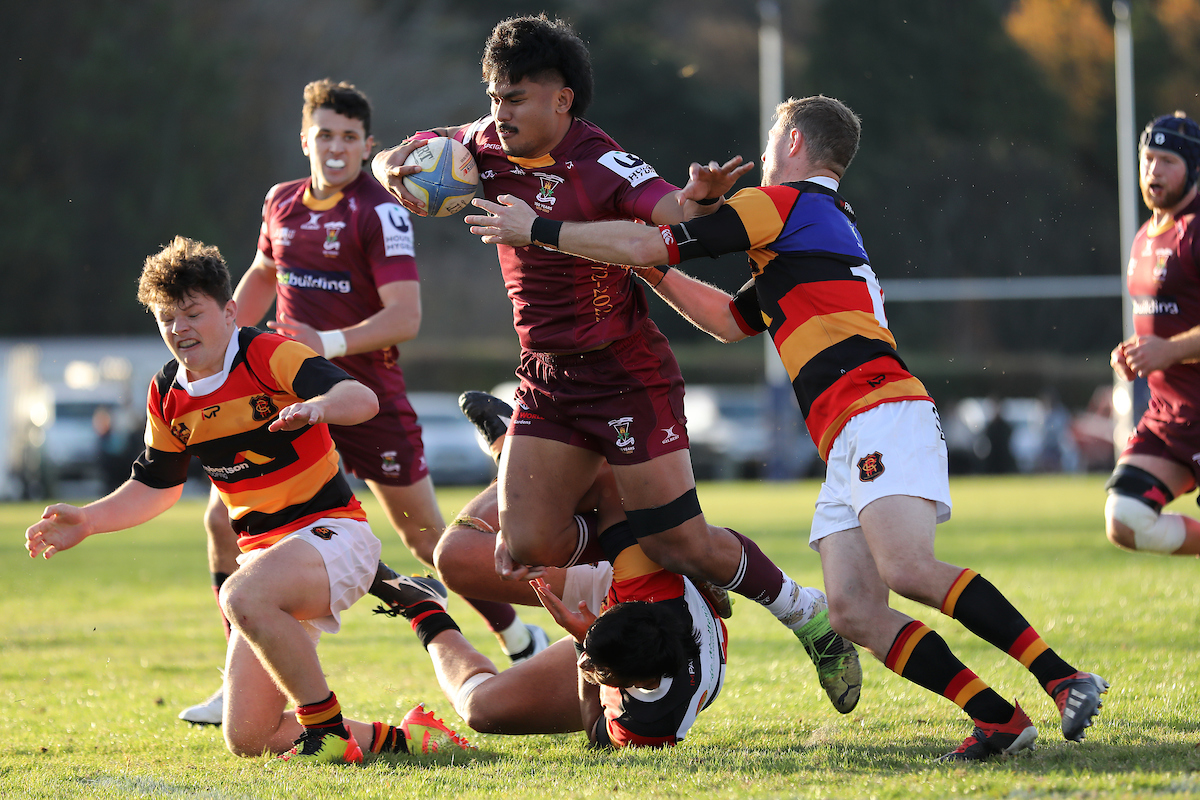 Will Siale of Alhambra Union is tackled during the Premier club rugby match between Zingari Richmond and Alhambra Union played for the Grace Mills Trophy at Montecillo in Dunedin on Saturday 28th May, 2022. © John Caswell / http://www.caswellimages.com