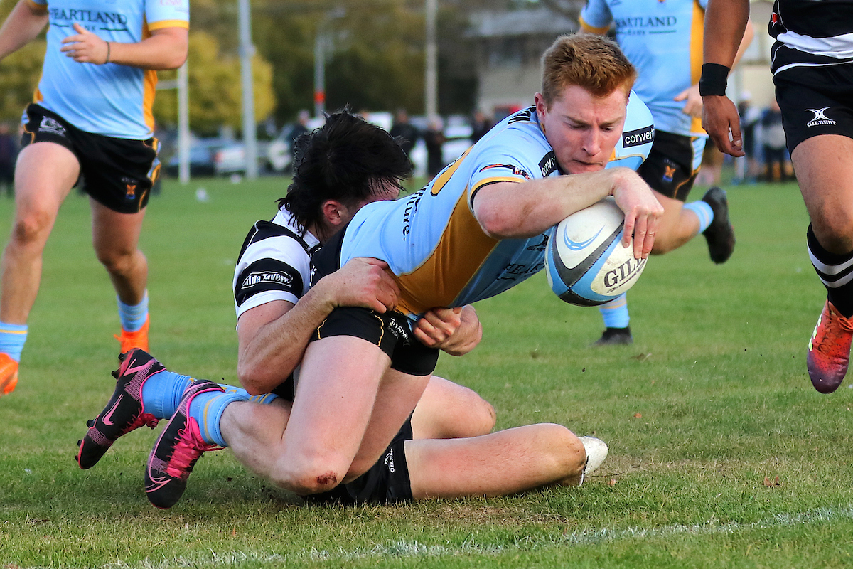 Tom Rance of University reaches out to score during the club rugby match between Southern and Otago University played for the V.G.Cavanagh Memorial Trophy at Bathgate Park in Dunedin on Saturday 30th April, 2022. © John Caswell / http://www.caswellimages.com