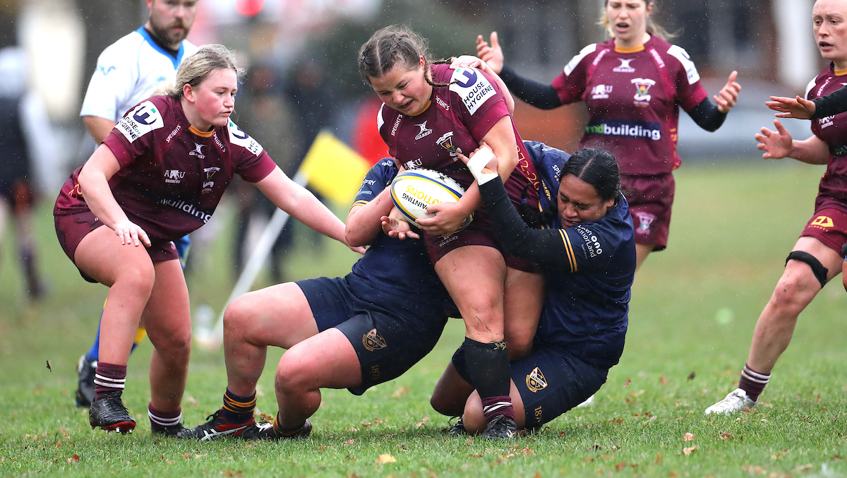 Paige Church is caught in a tackle during the Premier Women’s club rugby semi final between Alhambra Union and Dunedin played at the North Ground in Dunedin on Saturday 11th June, 2022. © John Caswell / http://www.caswellimages.com