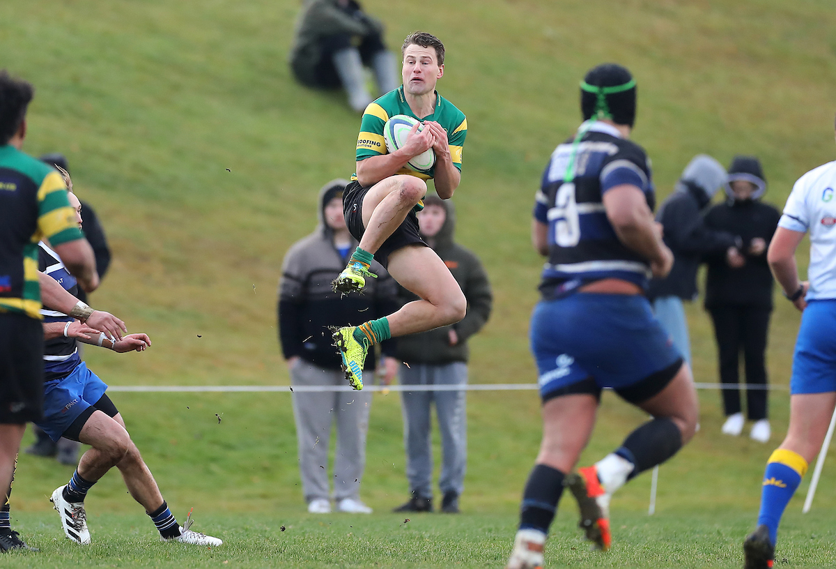 Finn Strawbridge of Green Island claims a kick during the Premier club rugby match between Kaikorai and Green Island played at Bishopscourt in Dunedin on Saturday 11th June, 2022. © John Caswell / http://www.caswellimages.com